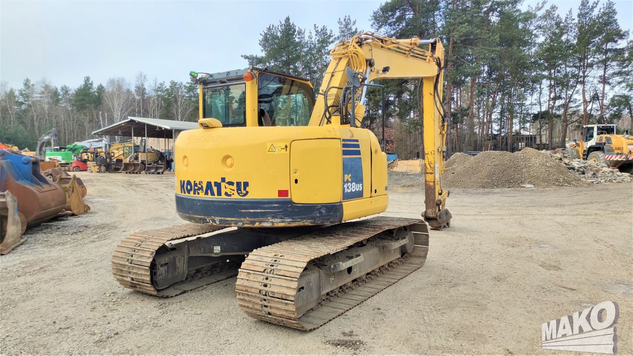 2013 Komatsu PC138US-8 crawler excavator, rear three-quarter view 2013 Komatsu PC138US-8 crawler excavator, rear three-quarter view