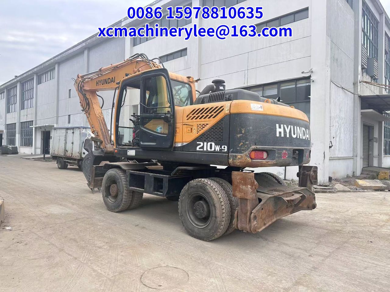 2022 Hyundai R210W-9 wheel excavator rear three-quarter view
