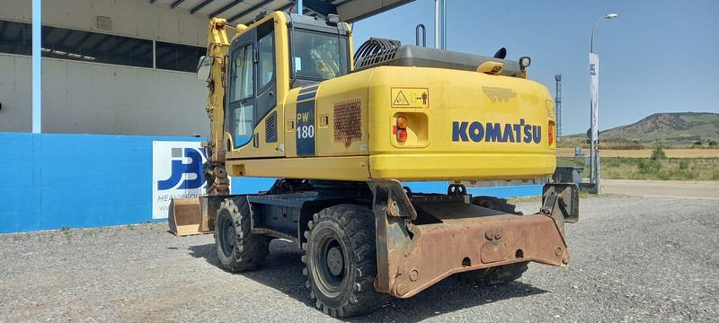 2016 Komatsu PW180-7EO wheel excavator, rear three-quarter view 2016 Komatsu PW180-7EO wheel excavator, rear three-quarter view