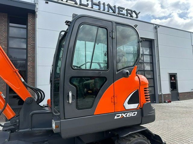 2018 Doosan DX60 wheel excavator side view of the cab 2018 Doosan DX60 wheel excavator side view of the cab