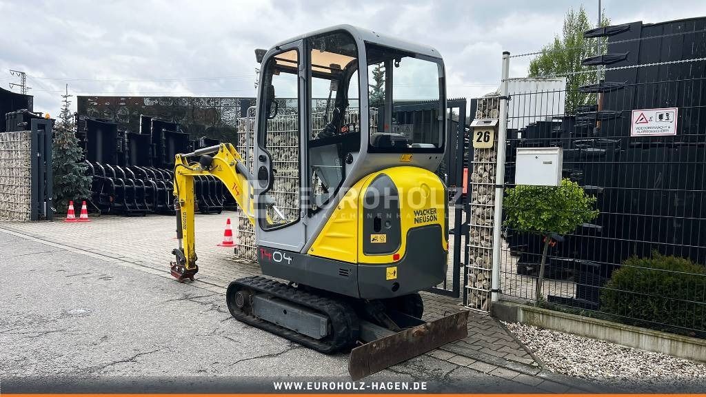 2015 Wacker Neuson 1404 mini excavator, rear three-quarter view