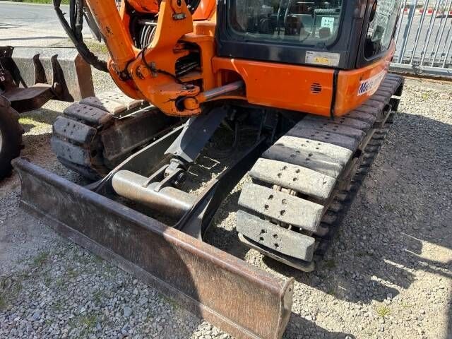 2016 Komatsu PC80MR-3 mini excavator front view with blade
