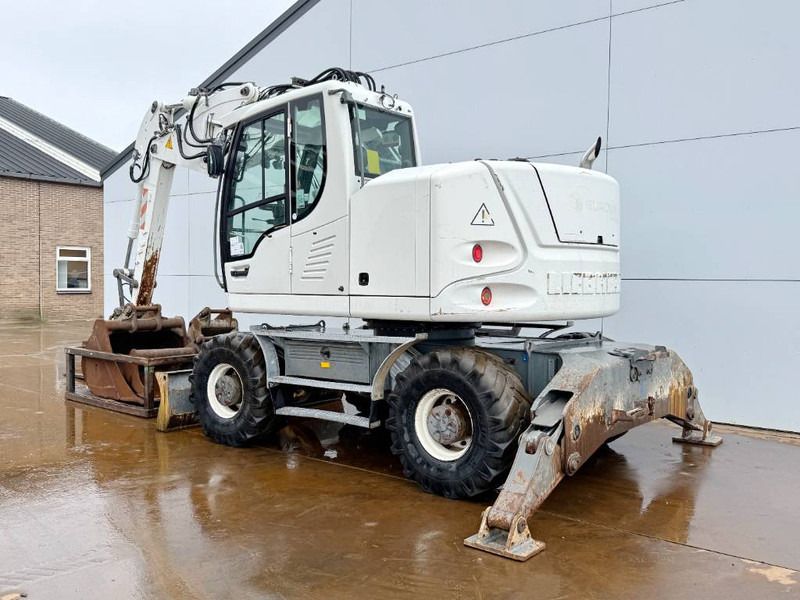 2012 Liebherr A914 COMPACT wheel excavator, rear three-quarter view 2012 Liebherr A914 COMPACT wheel excavator, rear three-quarter view
