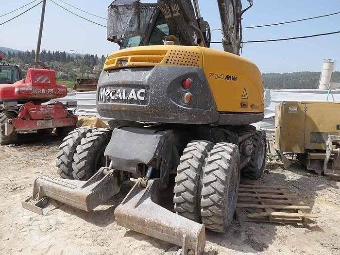2013 Mecalac 714 MW wheel excavator, rear three-quarter view