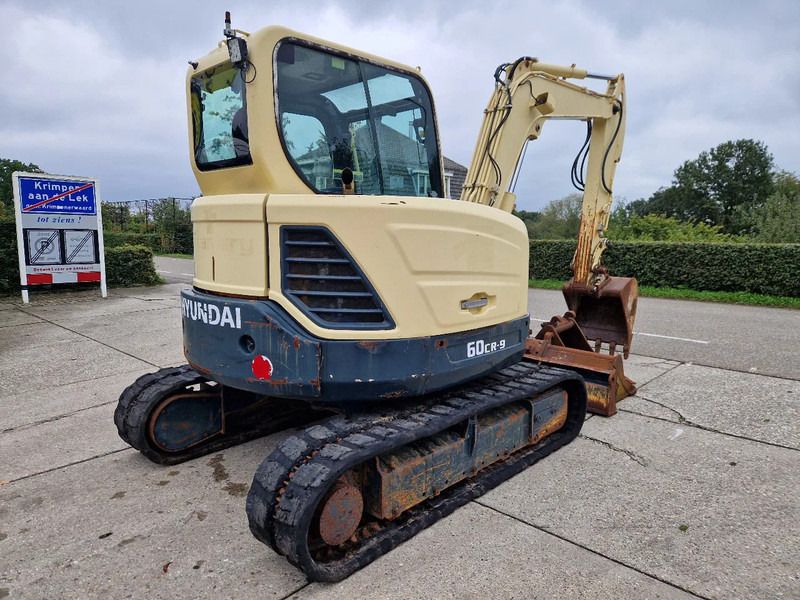2014 Hyundai 60CR-9 mini excavator, rear three-quarter view 2014 Hyundai 60CR-9 mini excavator, rear three-quarter view