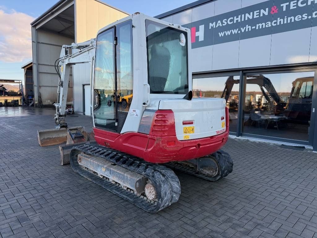 2017 Takeuchi TB250 mini excavator, rear three-quarter view 2017 Takeuchi TB250 mini excavator, rear three-quarter view