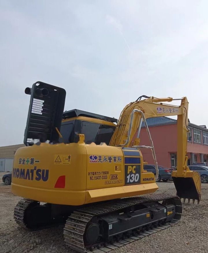 2019 Komatsu PC130 crawler excavator, rear three-quarter view 2019 Komatsu PC130 crawler excavator, rear three-quarter view