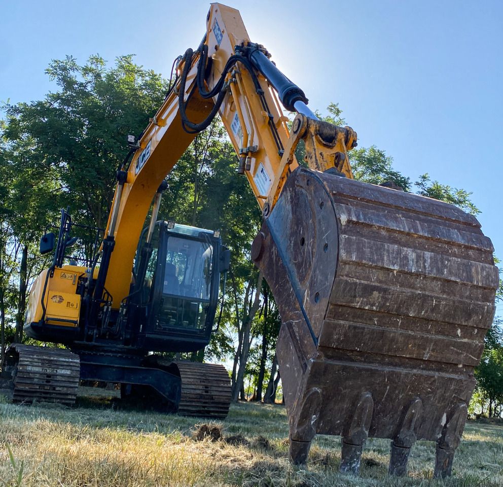 2019 JCB JS131LC excavator, low-angle front view