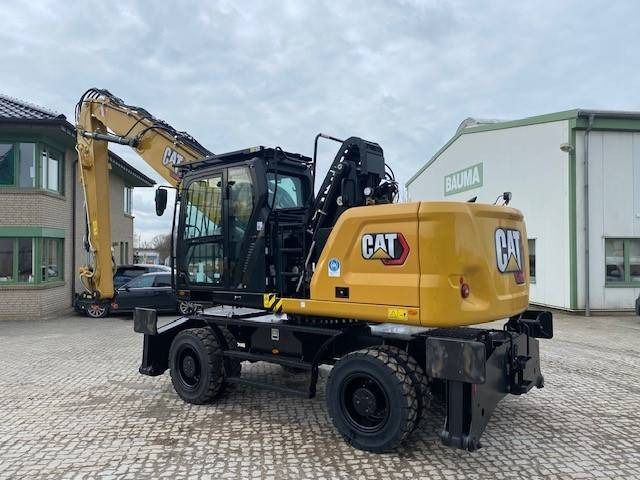 2024 Caterpillar MH3024-07D material handler, rear three-quarter view