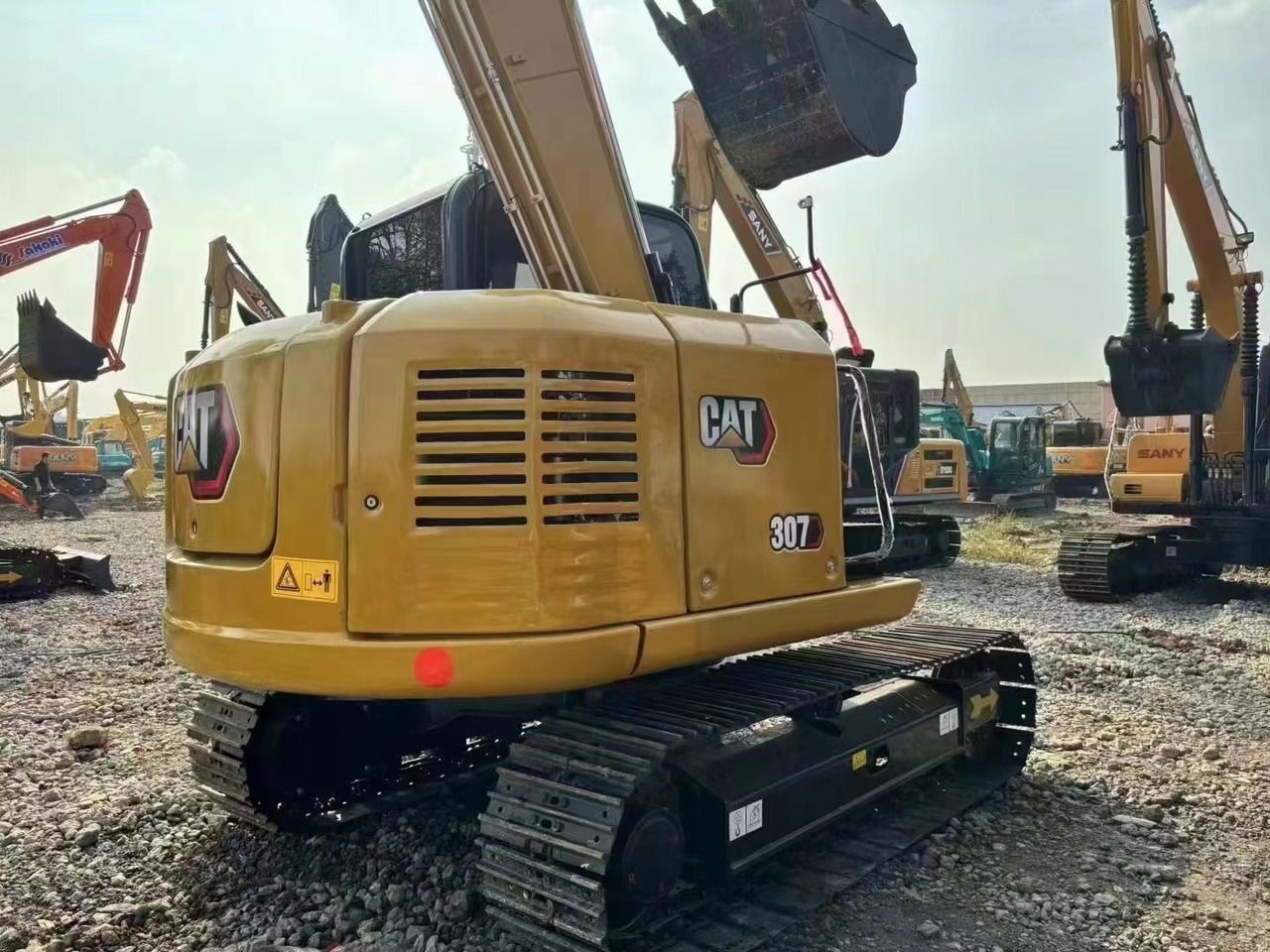 2022 Caterpillar 307E mini excavator rear three-quarter view 2022 Caterpillar 307E mini excavator rear three-quarter view