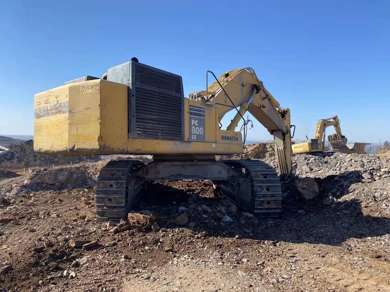 2011 Komatsu PC800SE-7 crawler excavator, rear three-quarter view 2011 Komatsu PC800SE-7 crawler excavator, rear three-quarter view