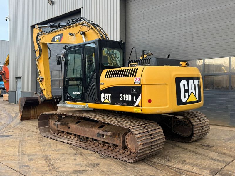 2011 Caterpillar 319D L crawler excavator, rear three-quarter view