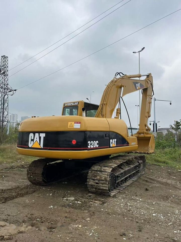 2021 Caterpillar 320C crawler excavator rear three-quarter view