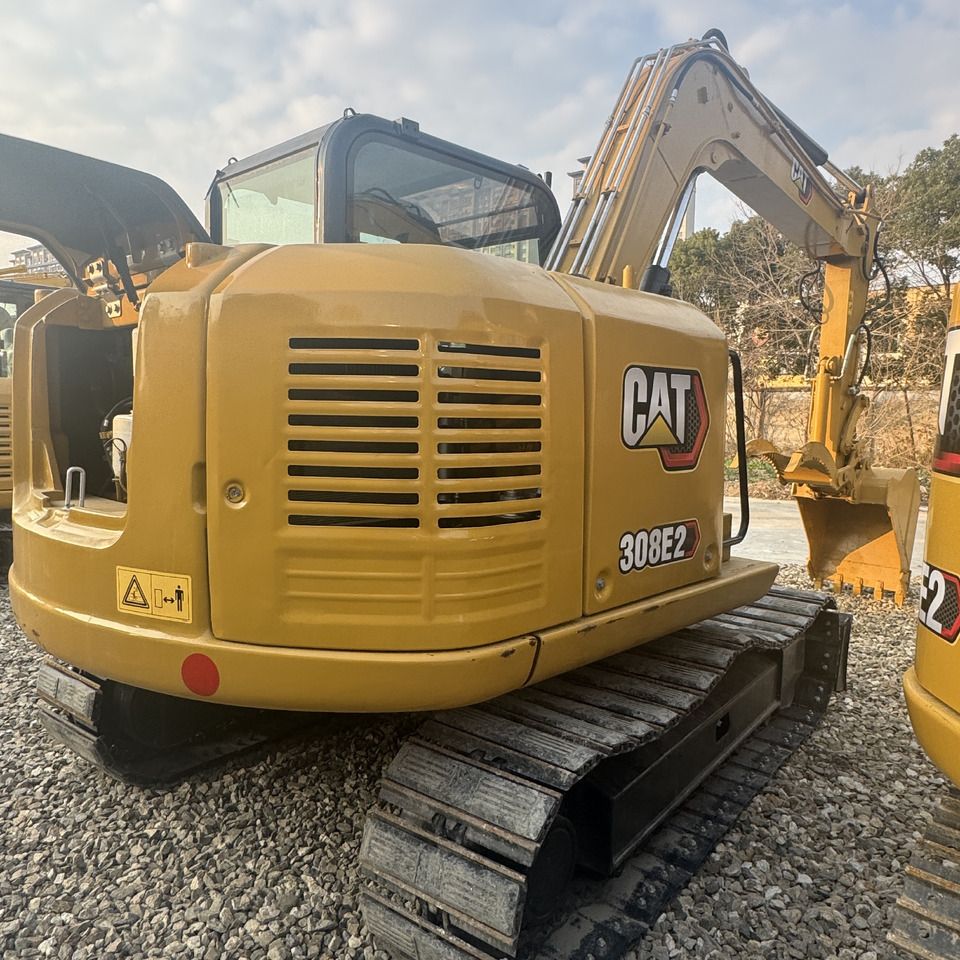 2023 Caterpillar 308E2 crawler excavator, rear three-quarter view 2023 Caterpillar 308E2 crawler excavator, rear three-quarter view
