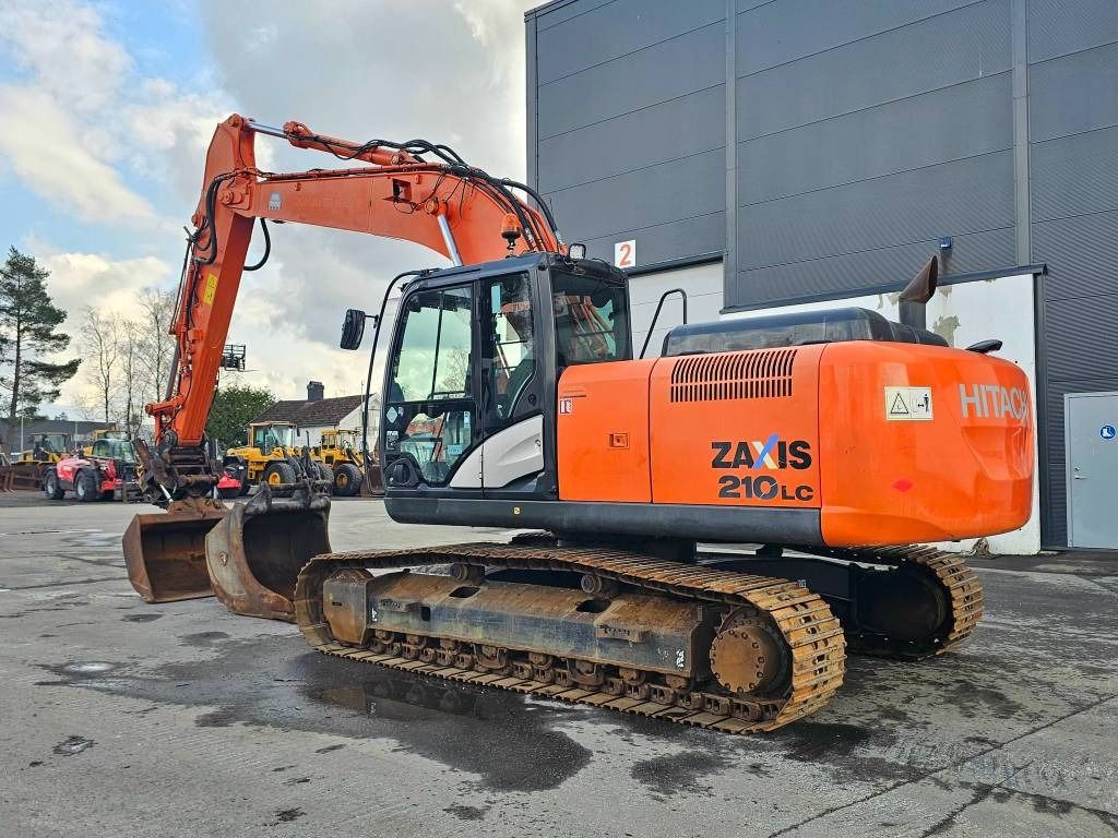 2014 Hitachi Zaxis 210LC crawler excavator, rear three-quarter view 2014 Hitachi Zaxis 210LC crawler excavator, rear three-quarter view