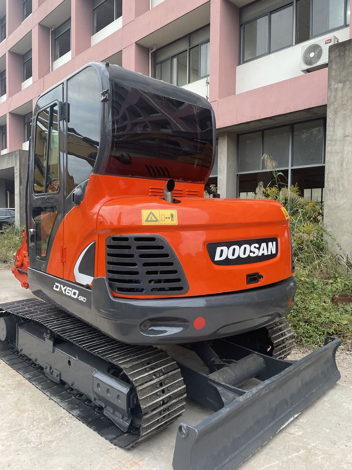 2021 Doosan DX60-9C crawler excavator, rear three-quarter view 2021 Doosan DX60-9C crawler excavator, rear three-quarter view