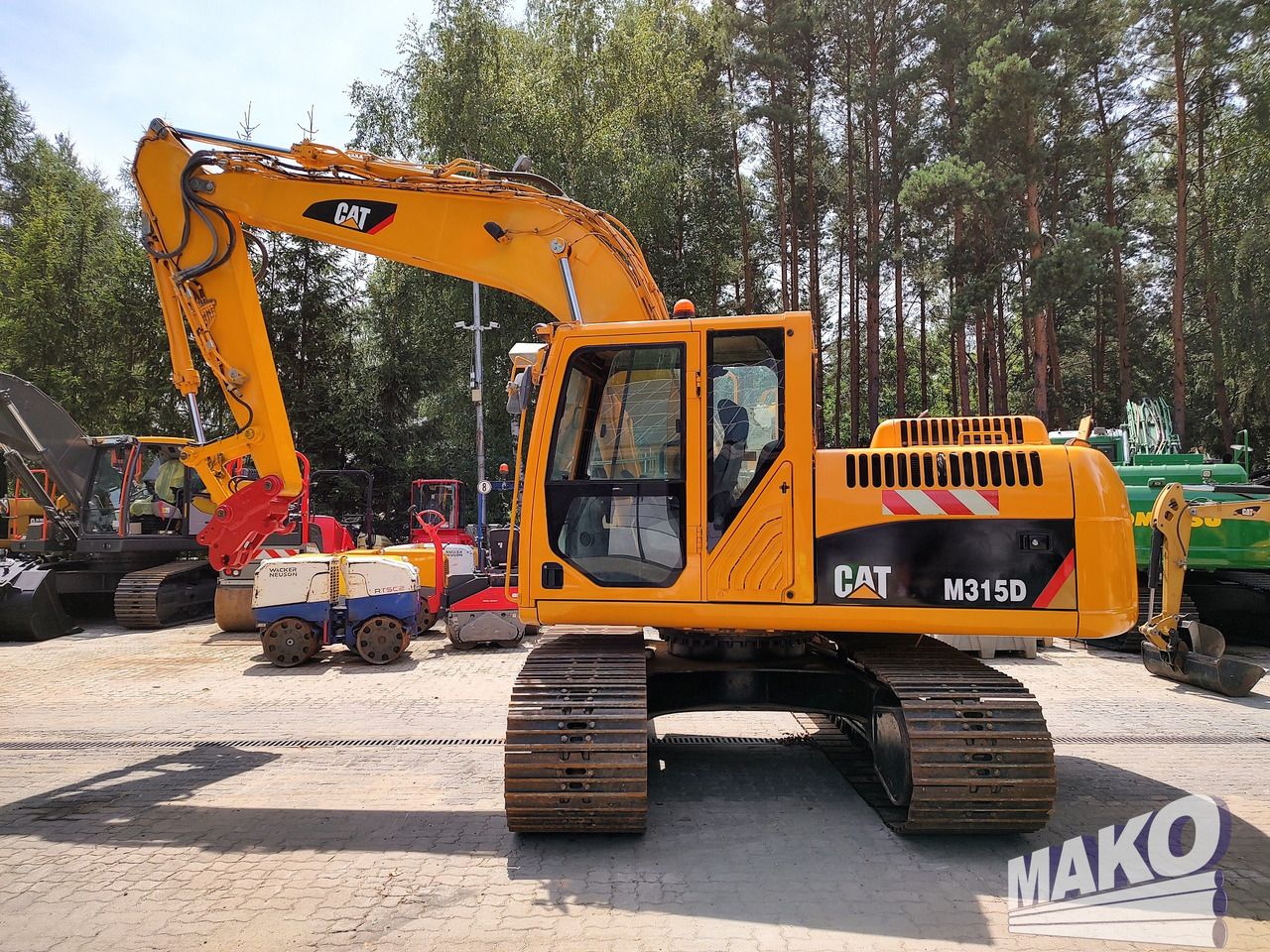 2011 Caterpillar M315D crawler excavator, side view 2011 Caterpillar M315D crawler excavator, side view