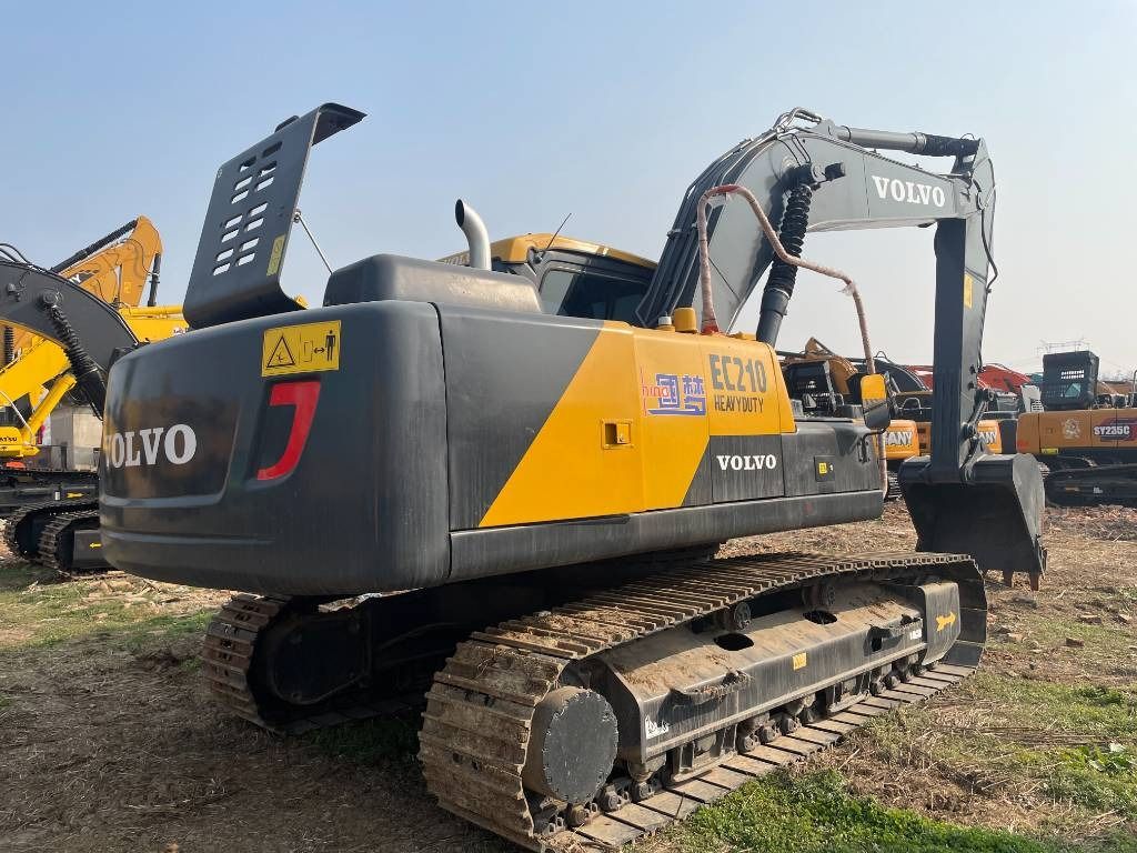 2025 Volvo EC210 crawler excavator, rear three-quarter view