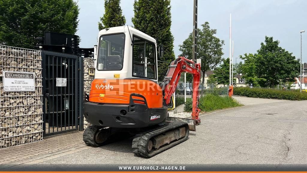2010 Kubota KX91-3 S2 mini excavator, rear three-quarter view