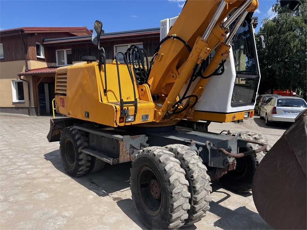 1999 Liebherr A316 wheel excavator, rear three-quarter view 1999 Liebherr A316 wheel excavator, rear three-quarter view