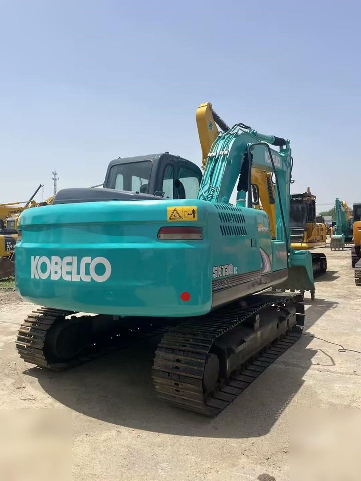 2021 Kobelco SK130LC crawler excavator, rear three-quarter view 2021 Kobelco SK130LC crawler excavator, rear three-quarter view