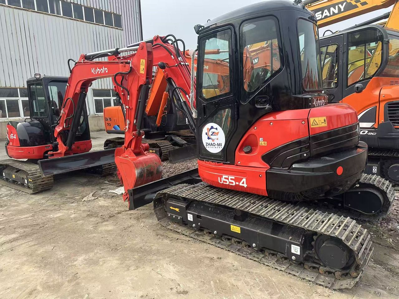 2024 Kubota U55-4 mini excavator, rear three-quarter view