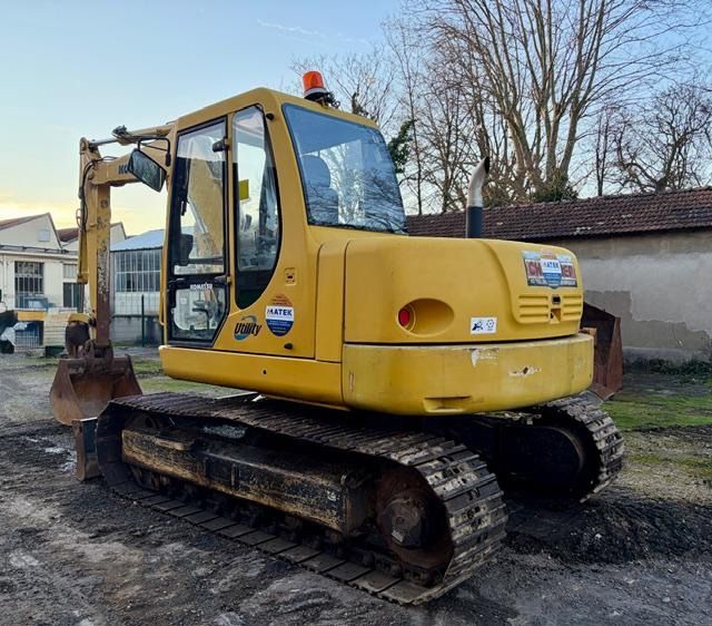 2006 Komatsu PC110 crawler excavator, rear three-quarter view 2006 Komatsu PC110 crawler excavator, rear three-quarter view