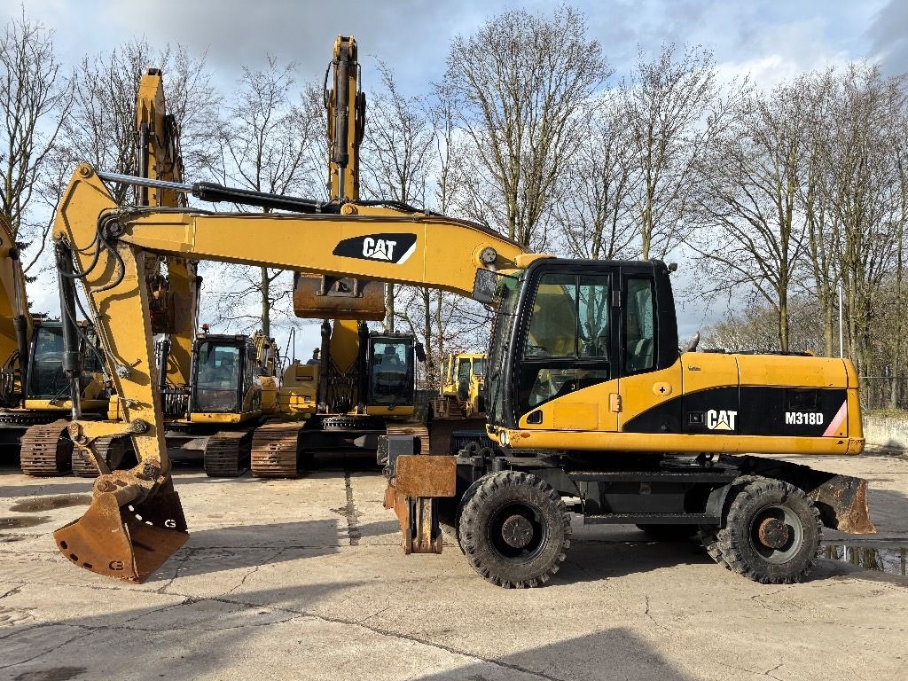 2008 Caterpillar M318D wheel excavator side view 2008 Caterpillar M318D wheel excavator side view