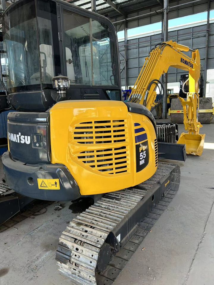 2023 Komatsu PC-55MR mini excavator, front three-quarter view