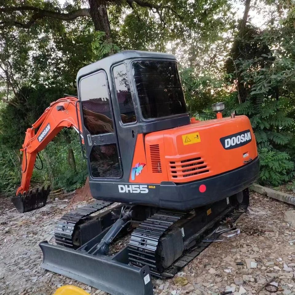 2022 Doosan DH55 Gold mini excavator, rear three-quarter view