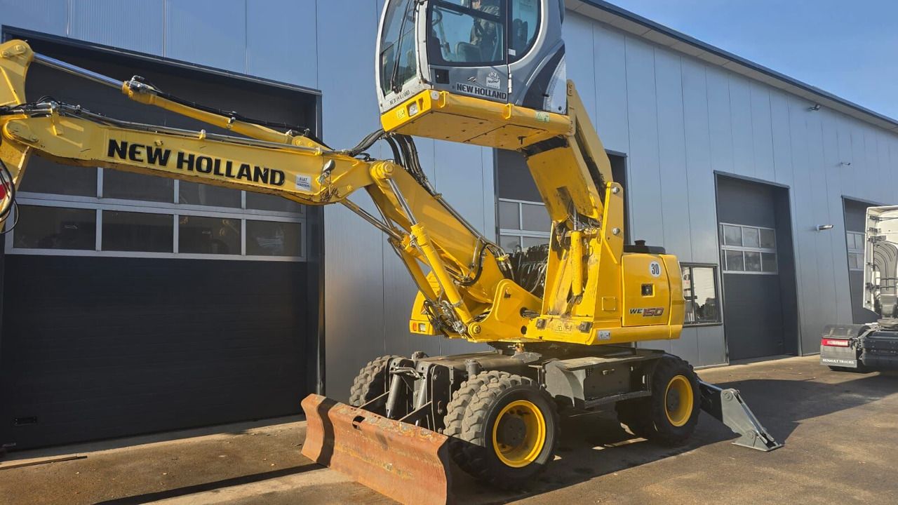 2011 New Holland WE150C wheel excavator, side view 2011 New Holland WE150C wheel excavator, side view