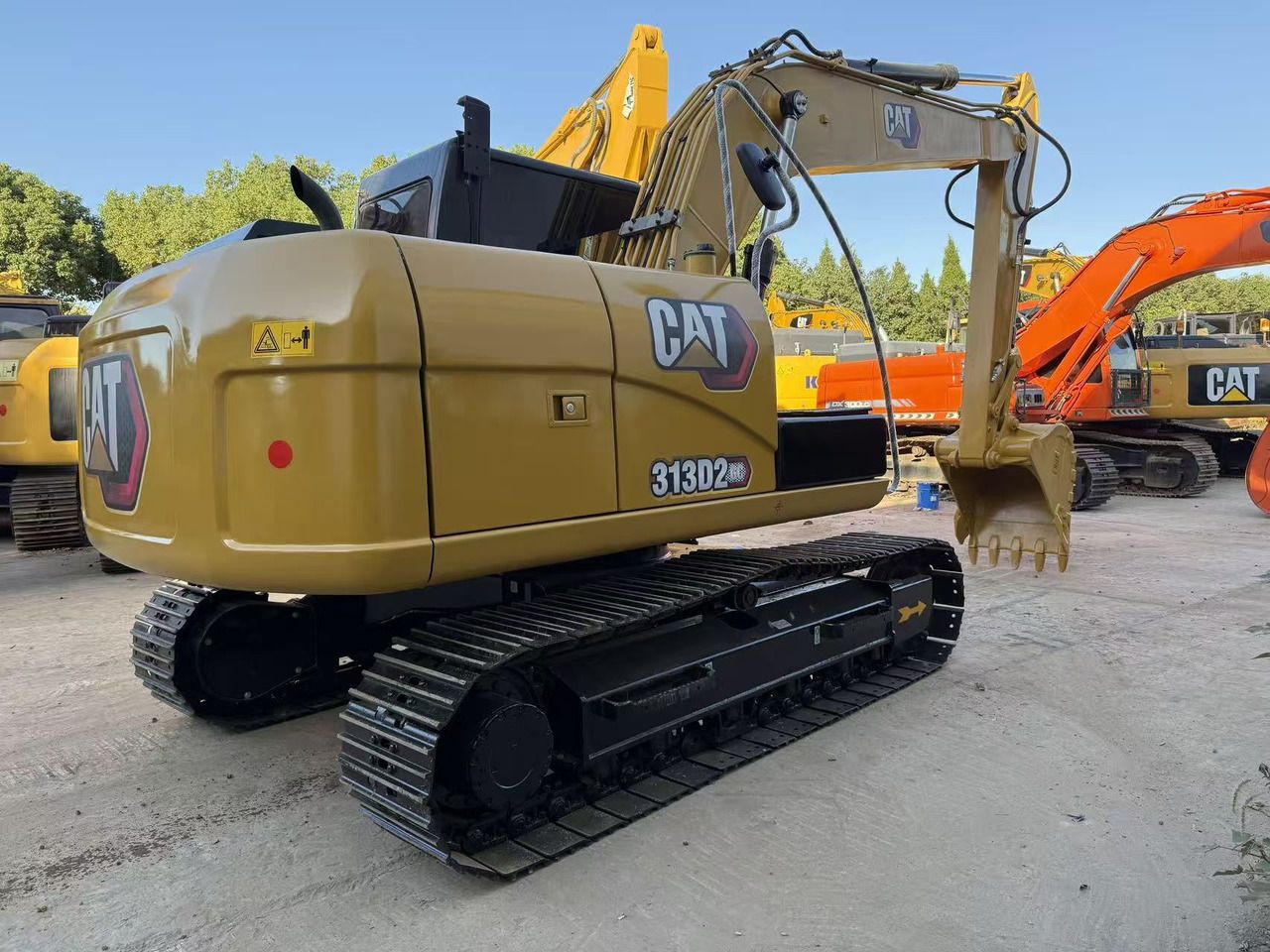 2021 Caterpillar 313D2 GC crawler excavator, rear three-quarter view 2021 Caterpillar 313D2 GC crawler excavator, rear three-quarter view