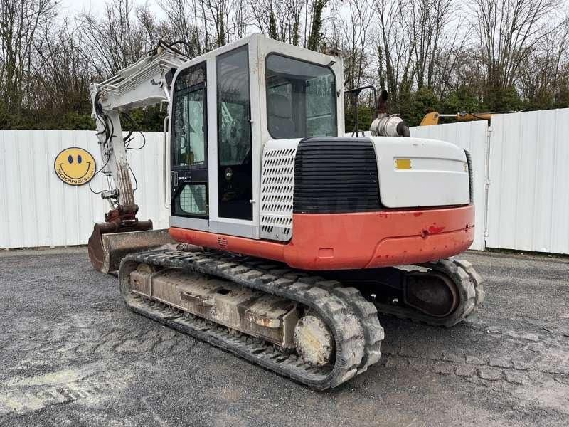 2004 Takeuchi TB1140 crawler excavator, rear three-quarter view 2004 Takeuchi TB1140 crawler excavator, rear three-quarter view