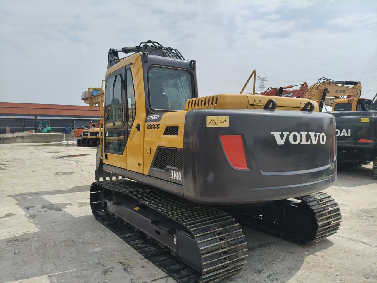 2023 Volvo EC140DL crawler excavator, rear three-quarter view 2023 Volvo EC140DL crawler excavator, rear three-quarter view