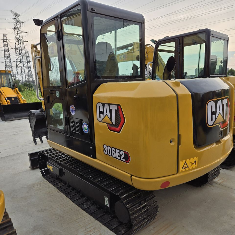 2024 Caterpillar 306E2 mini excavator, rear three-quarter view 2024 Caterpillar 306E2 mini excavator, rear three-quarter view