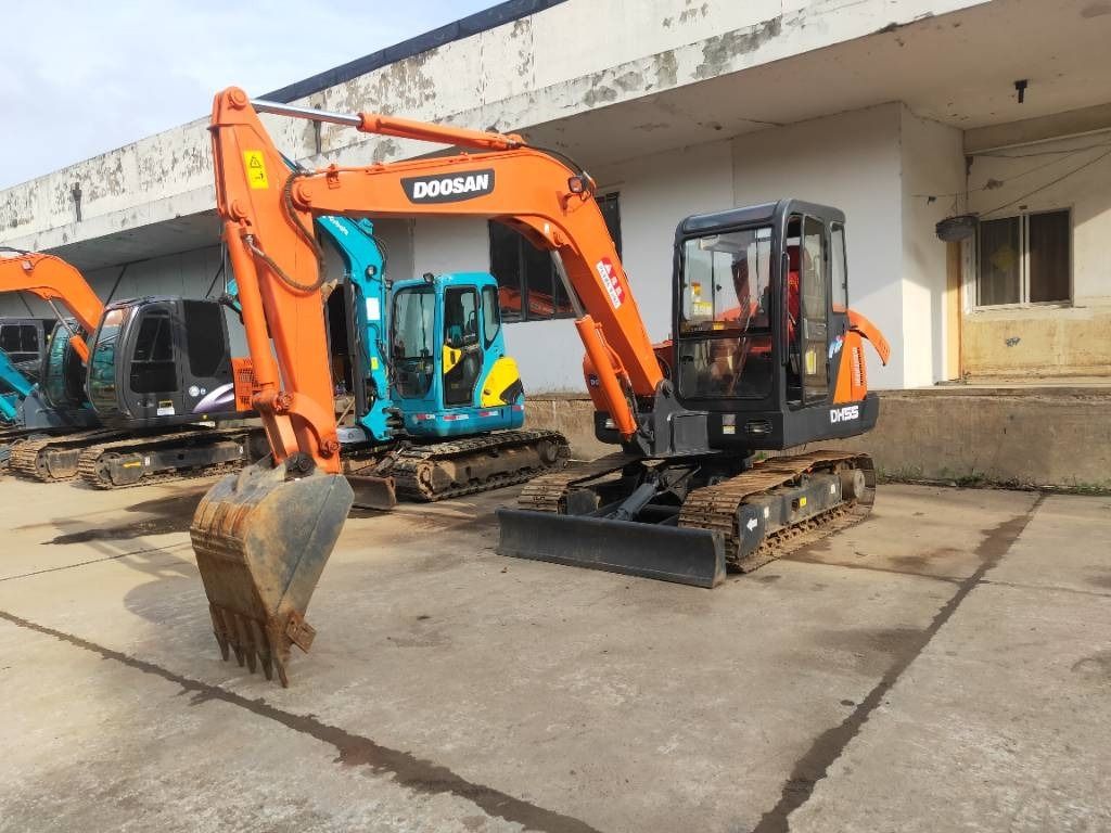 2023 Doosan DH55 mini excavator, front three-quarter view 2023 Doosan DH55 mini excavator, front three-quarter view