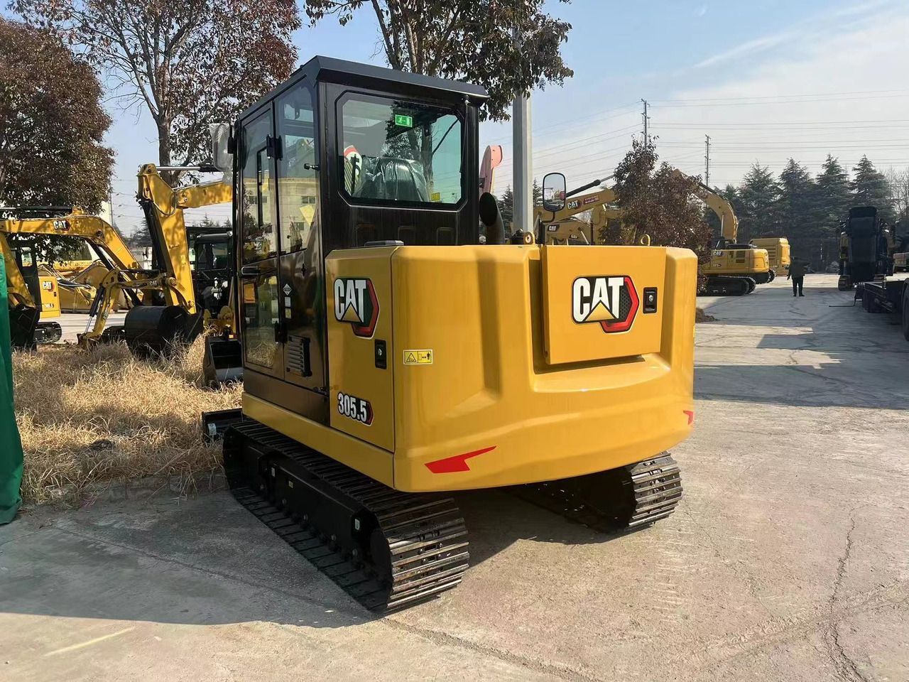 2026 Caterpillar 305.5 mini excavator rear three-quarter view 2026 Caterpillar 305.5 mini excavator rear three-quarter view