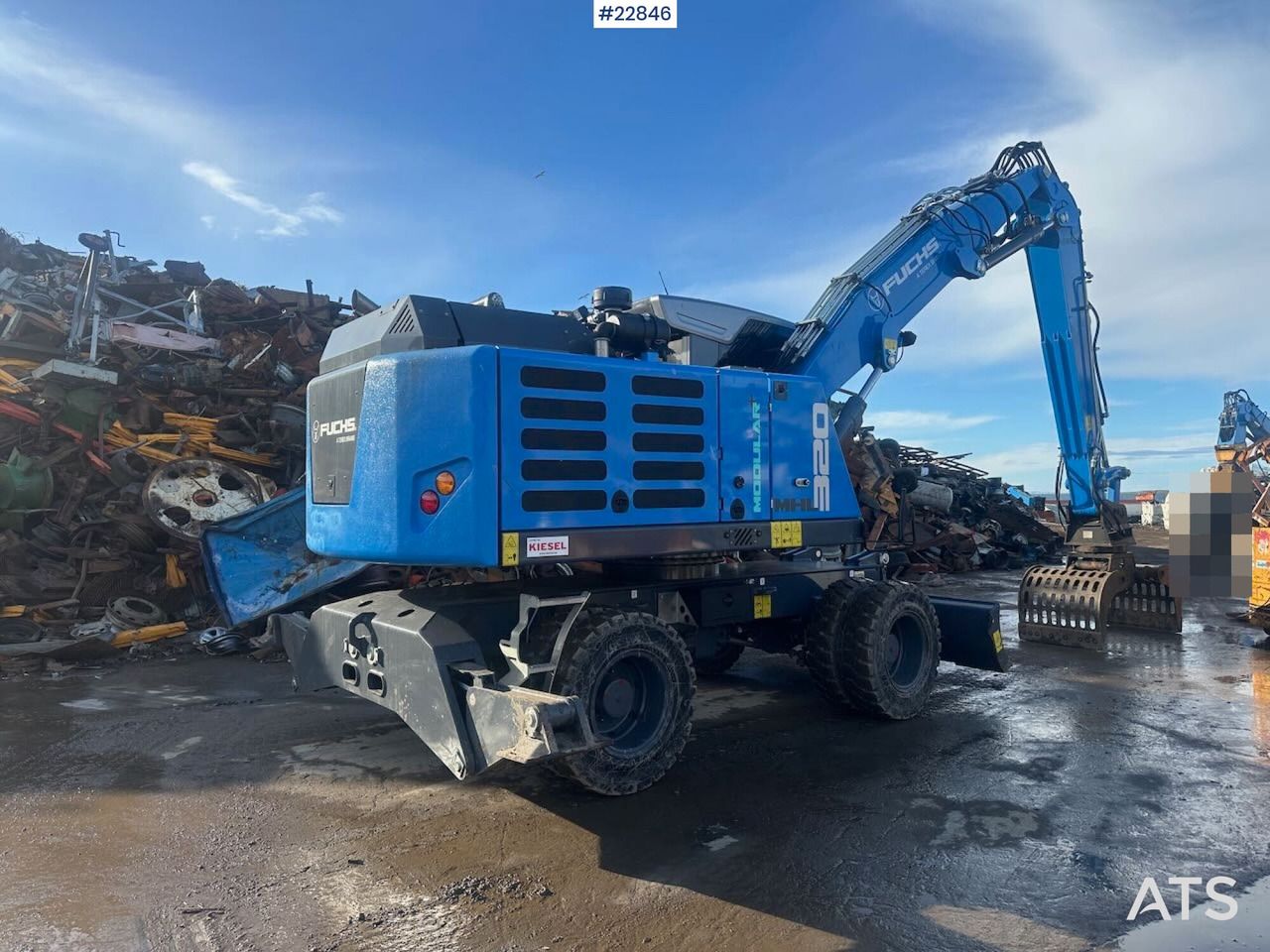 2025 Fuchs MHL320 SS wheel excavator, rear three-quarter view
