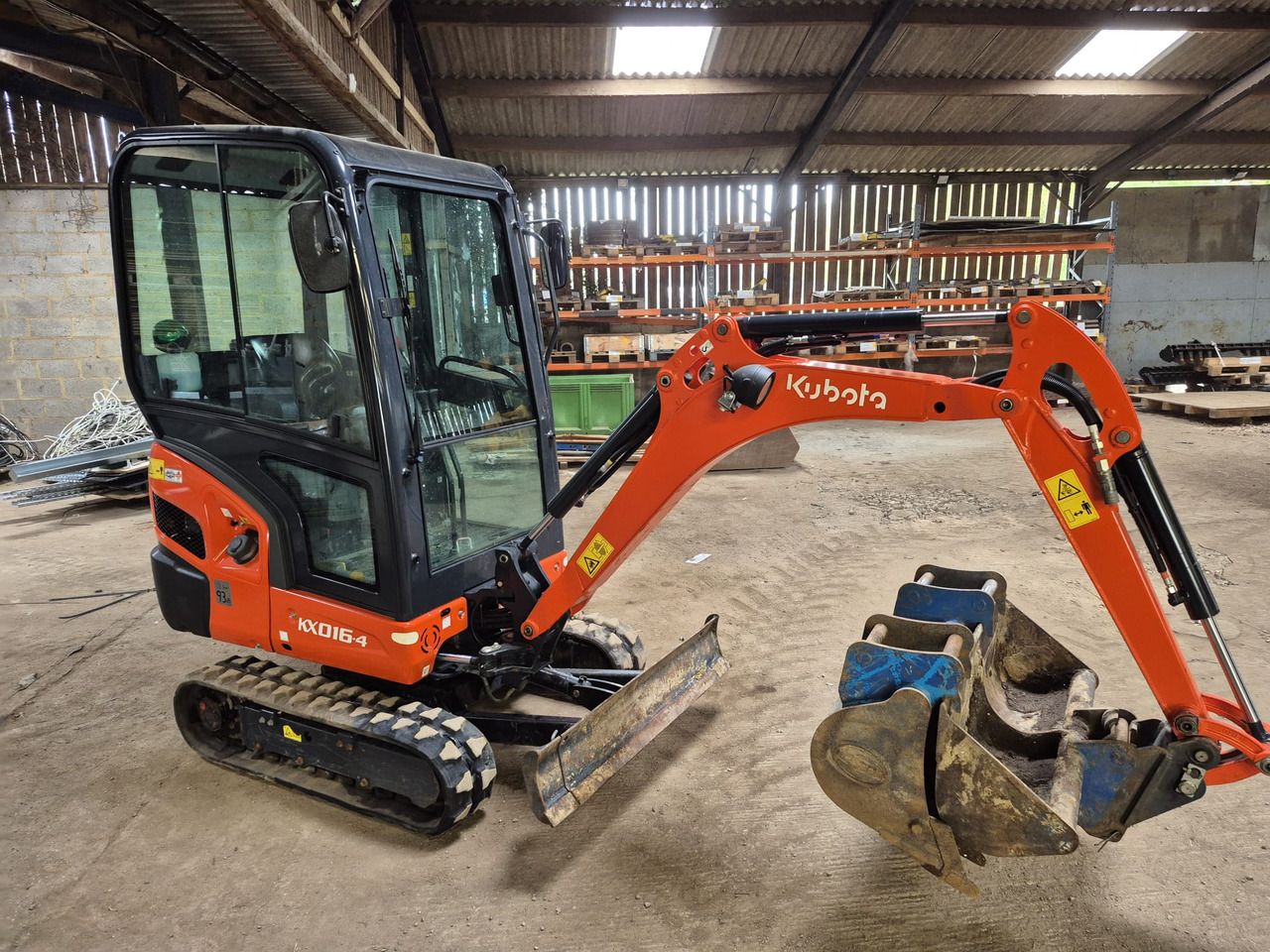 2022 Kubota KX016-4 mini excavator, side view 2022 Kubota KX016-4 mini excavator, side view