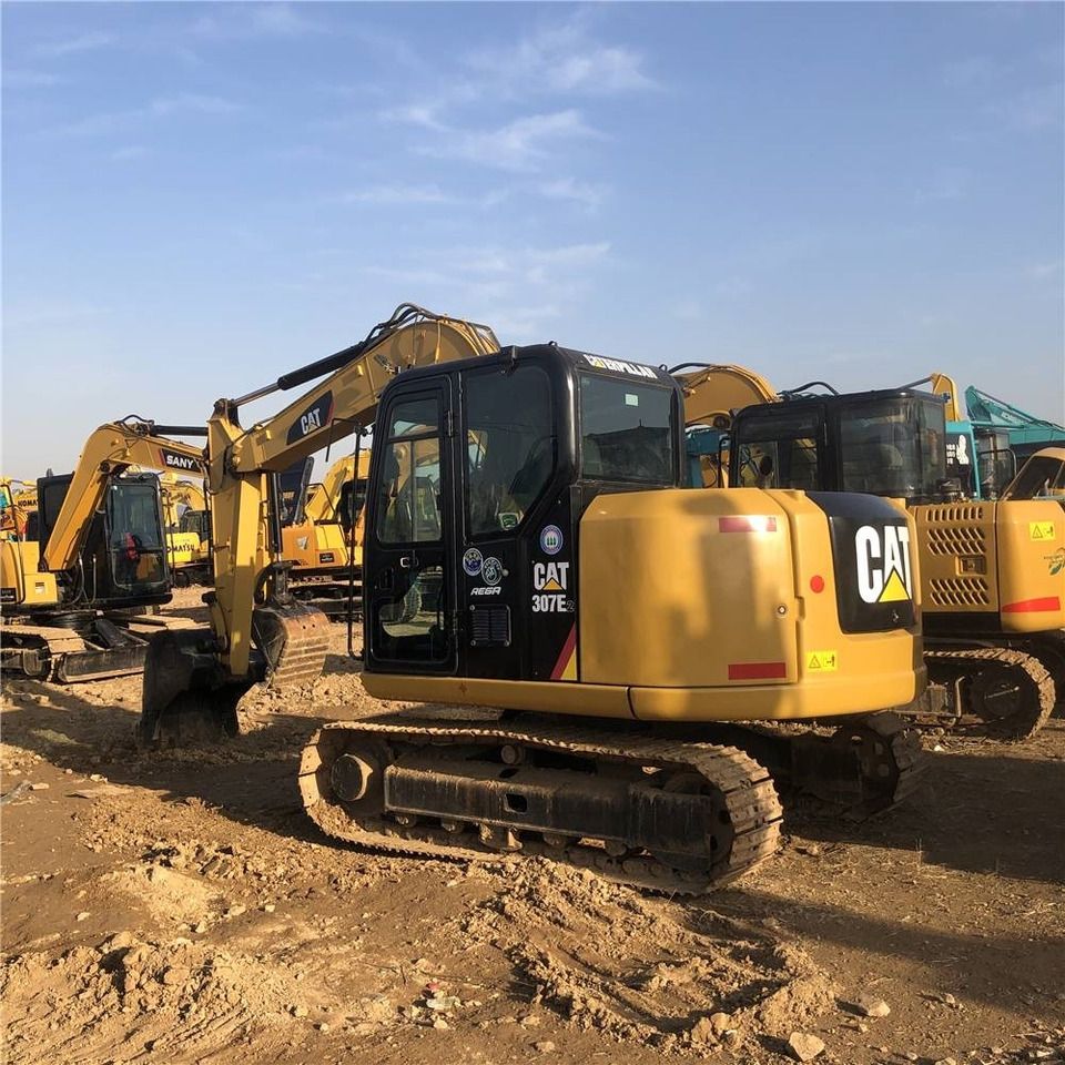 2023 Caterpillar 307E2 mini excavator, rear three-quarter view 2023 Caterpillar 307E2 mini excavator, rear three-quarter view