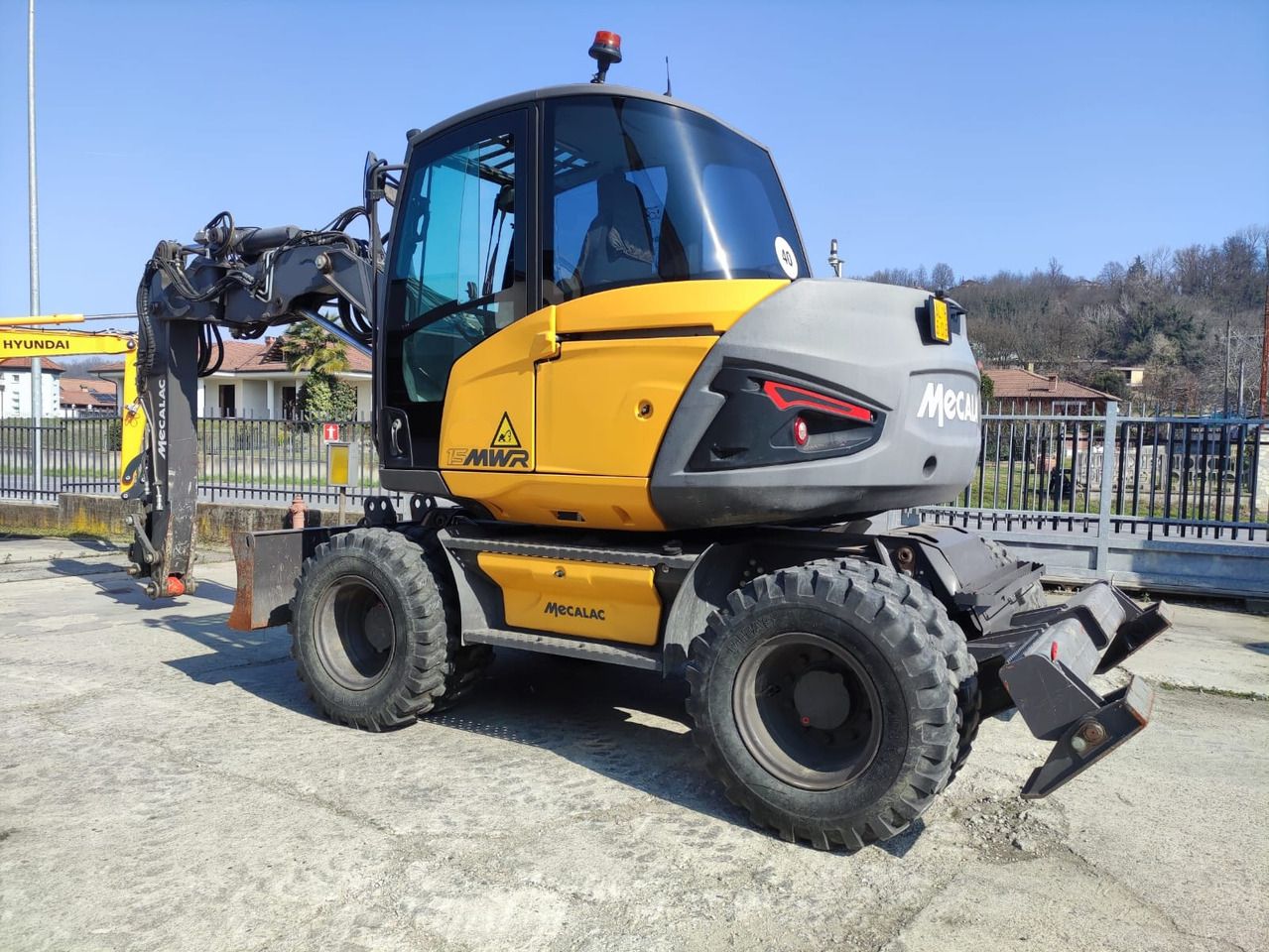 2019 Mecalac 15 MWR wheel excavator, rear three-quarter view 2019 Mecalac 15 MWR wheel excavator, rear three-quarter view