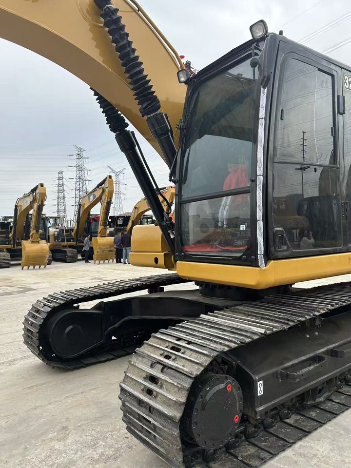 2023 Caterpillar 320 excavator, side view of cab and tracks