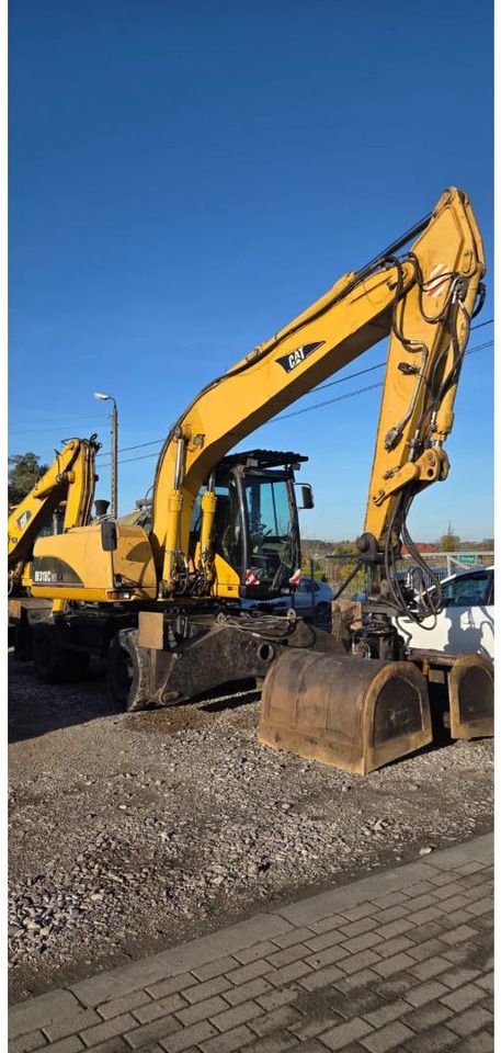 2006 Caterpillar M318CMH wheel excavator, side profile view