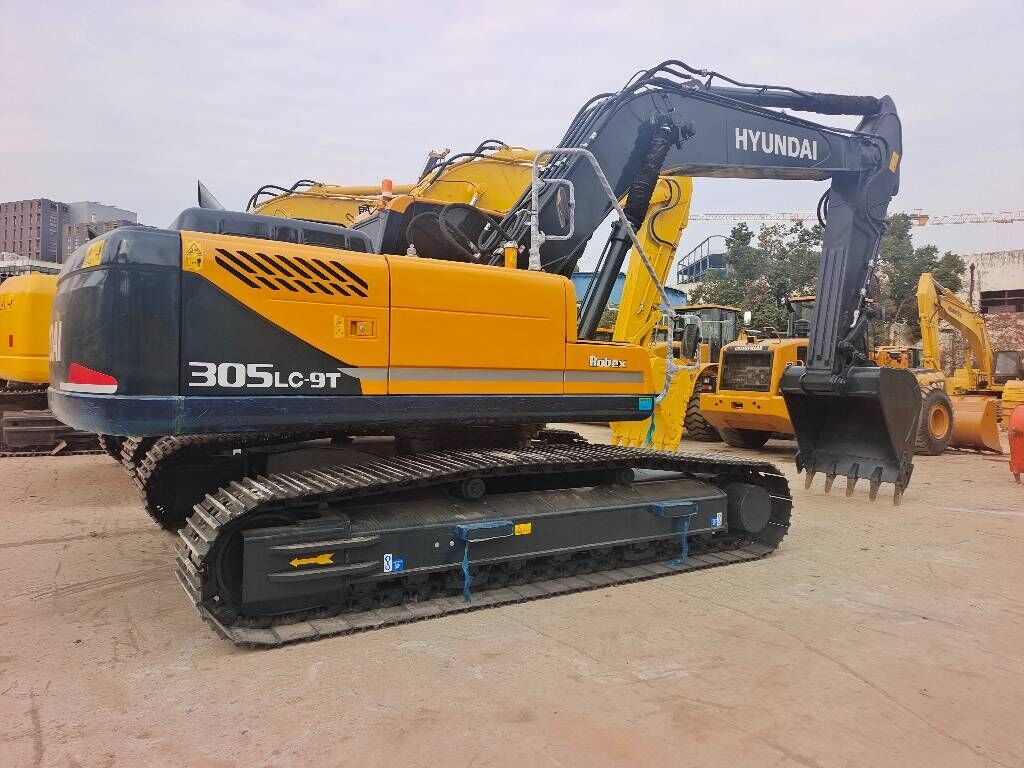 2025 Hyundai R305LC-9T crawler excavator, rear three-quarter view