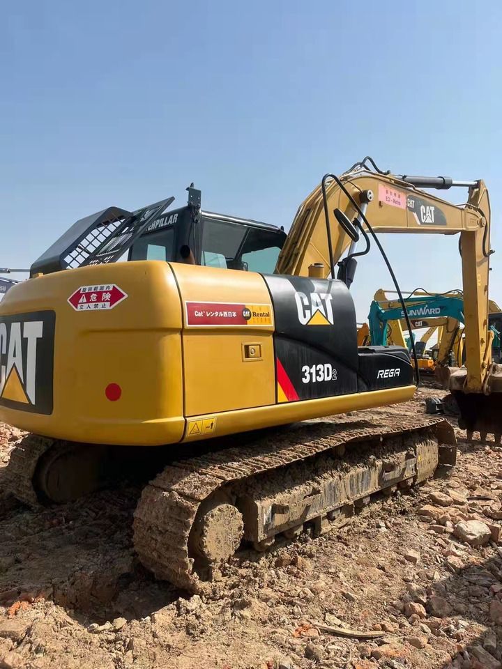 2023 Caterpillar 313D2 crawler excavator, rear three-quarter view