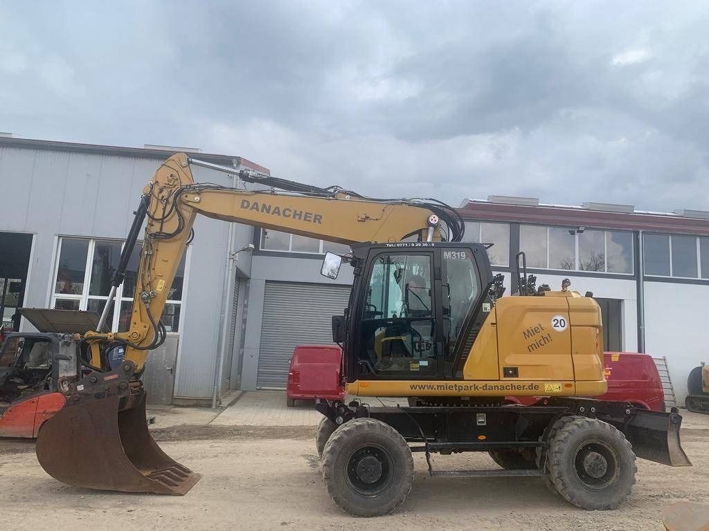 2022 Caterpillar M319-07B wheel excavator side view 2022 Caterpillar M319-07B wheel excavator side view