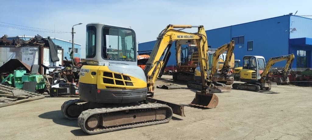 2006 New Holland E50.2C mini excavator, rear three-quarter view 2006 New Holland E50.2C mini excavator, rear three-quarter view
