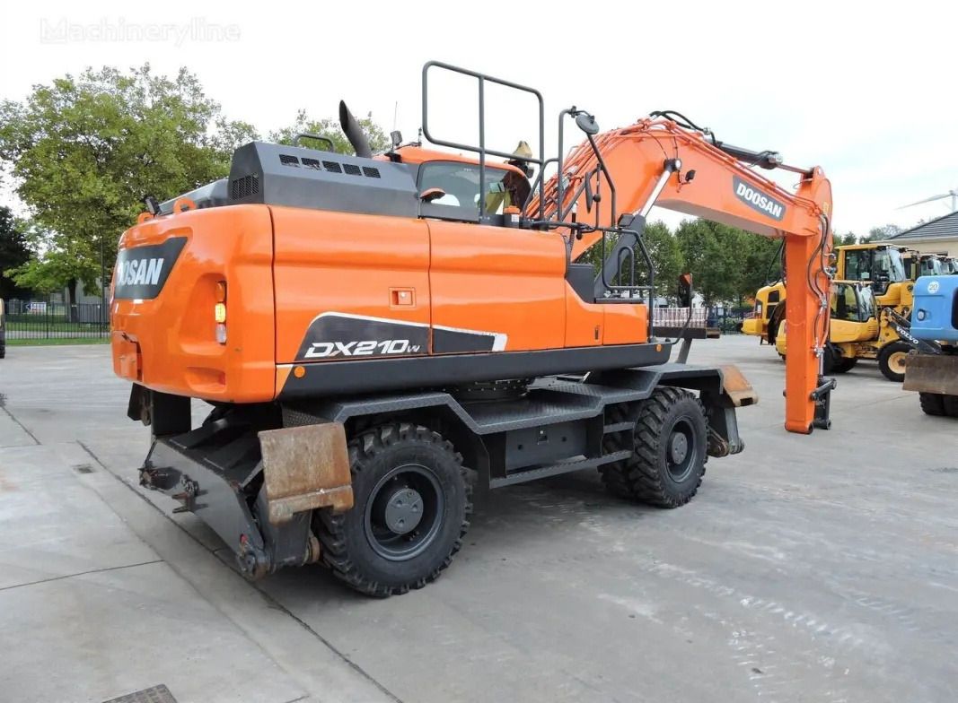 Doosan DX210W wheel excavator, rear three-quarter view Doosan DX210W wheel excavator, rear three-quarter view