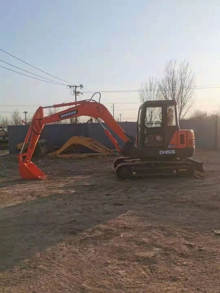 2023 Doosan DH55 mini excavator, side profile view