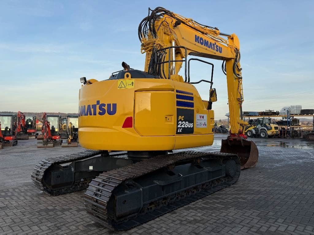 2016 Komatsu PC228 USLC-10 crawler excavator, rear three-quarter view 2016 Komatsu PC228 USLC-10 crawler excavator, rear three-quarter view